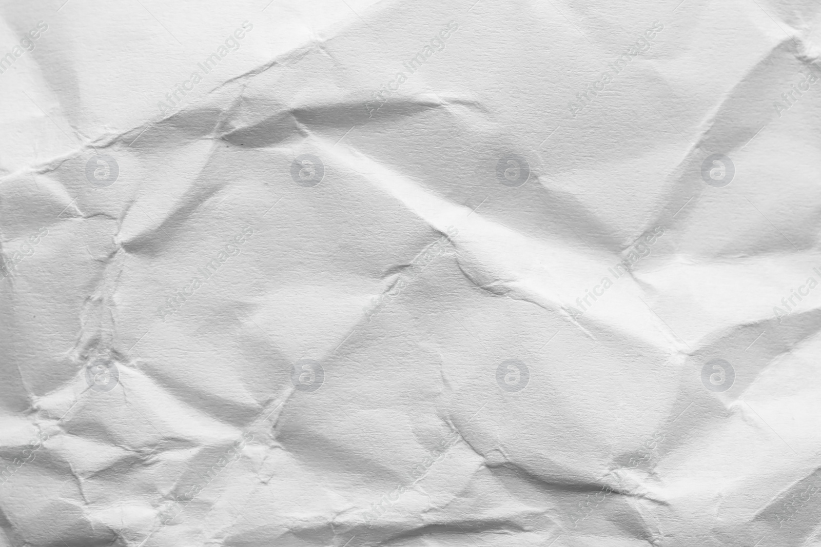 Photo of Sheet of crumpled paper as background. Space for design
