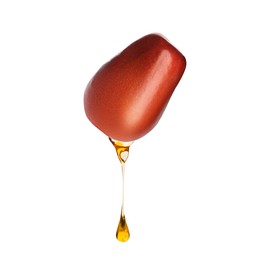 Image of Oil dripping from palm fruit on white background