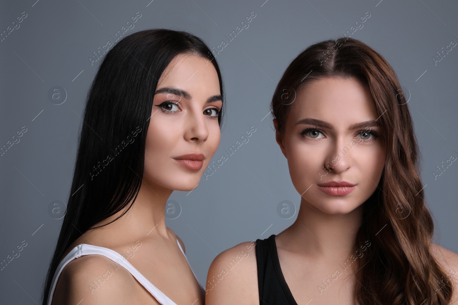 Photo of Portrait of beautiful women on grey background