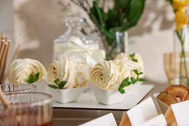 Photo of Tasty treats on table in room. Sweet buffet