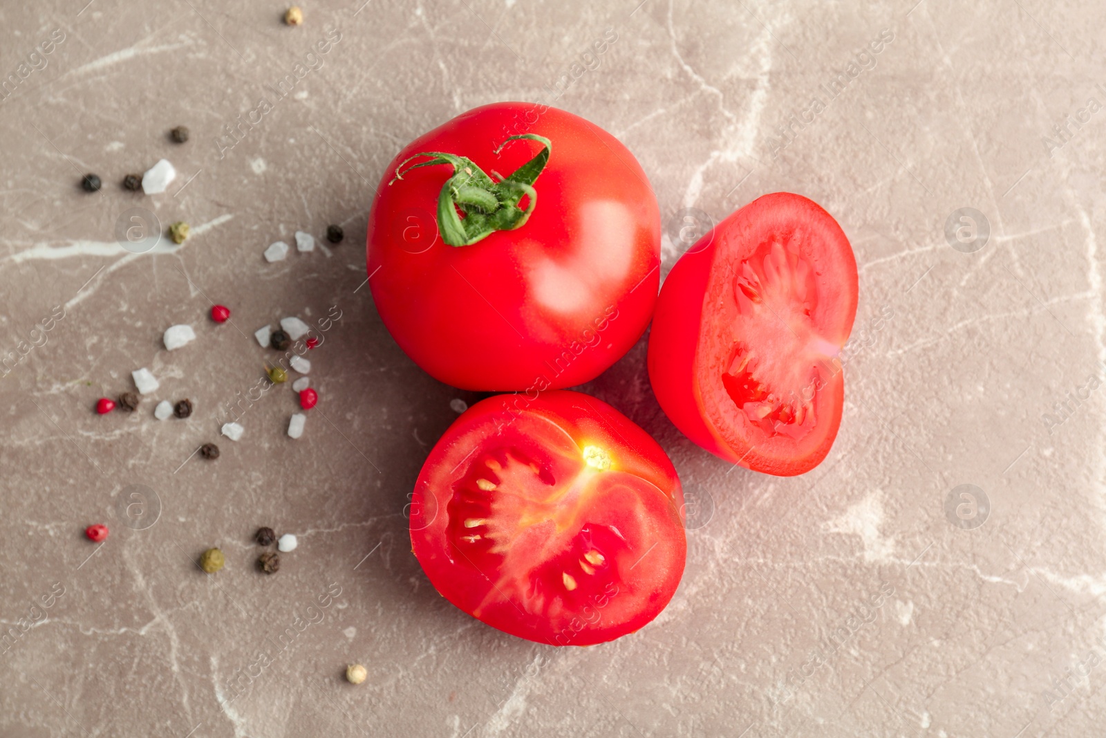 Photo of Fresh ripe tomatoes on grey background, top view