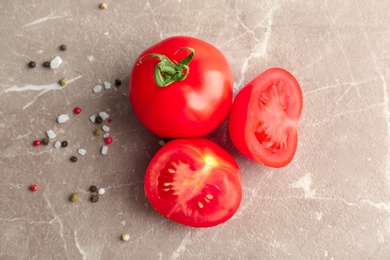 Photo of Fresh ripe tomatoes on grey background, top view