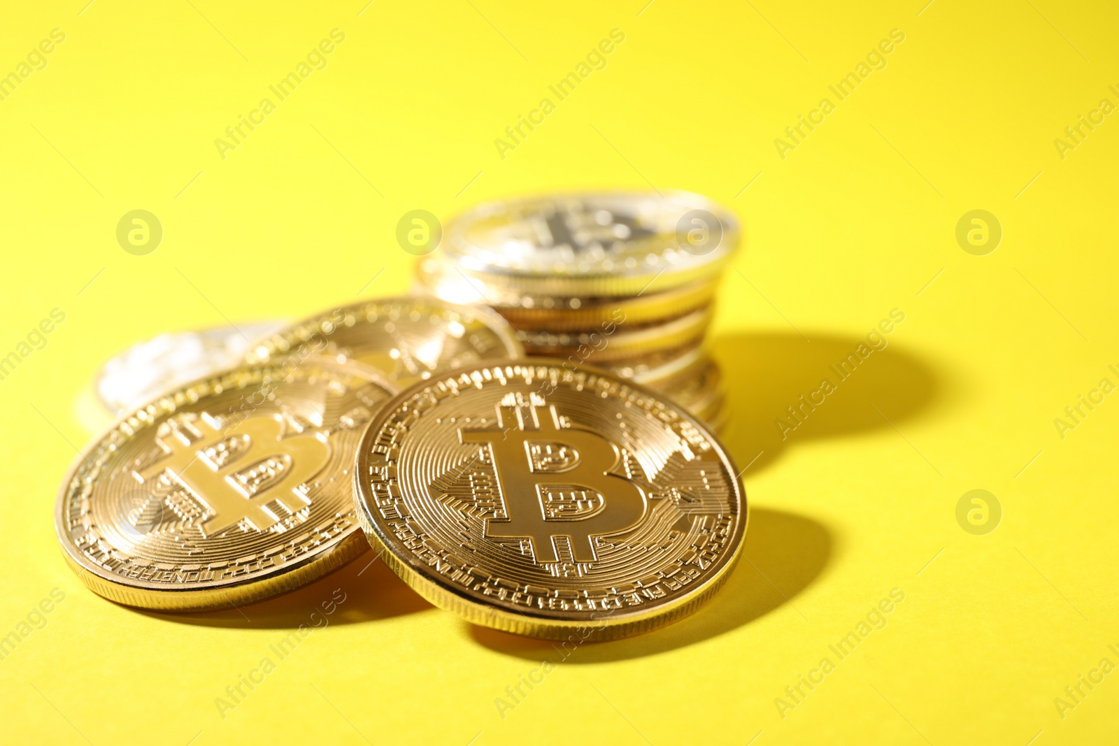 Photo of Bitcoins on color background, space for text. Digital currency