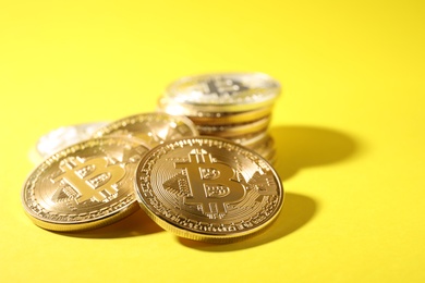 Bitcoins on color background, space for text. Digital currency