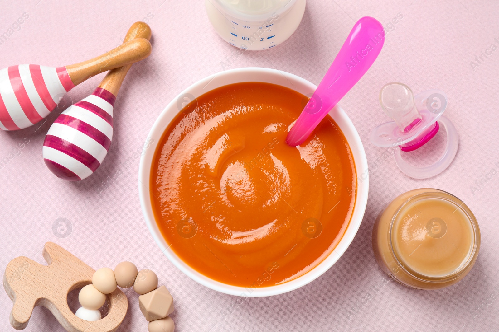 Photo of Flat lay composition with healthy baby food on light background