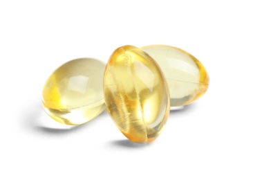 Cod liver oil pills on white background