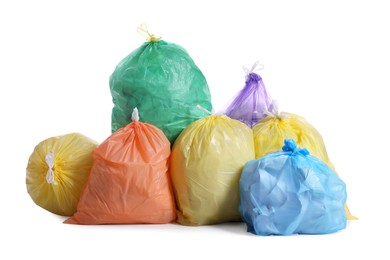 Photo of Trash bags full of garbage on white background