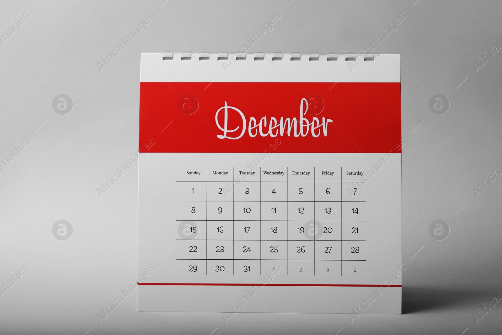 Photo of Paper calendar on grey background. Planning concept