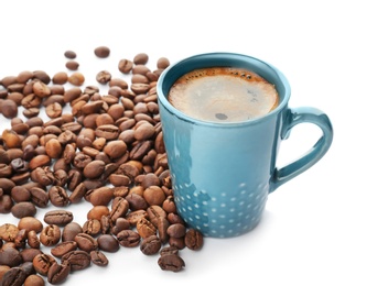 Photo of Cup of aromatic hot coffee and beans on white background