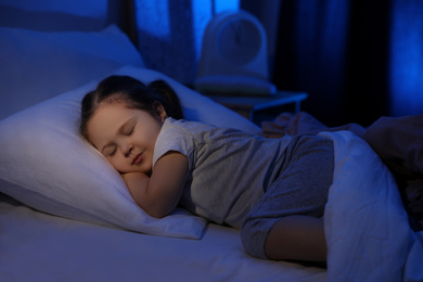 Photo of Cute little girl sleeping at home. Bedtime schedule