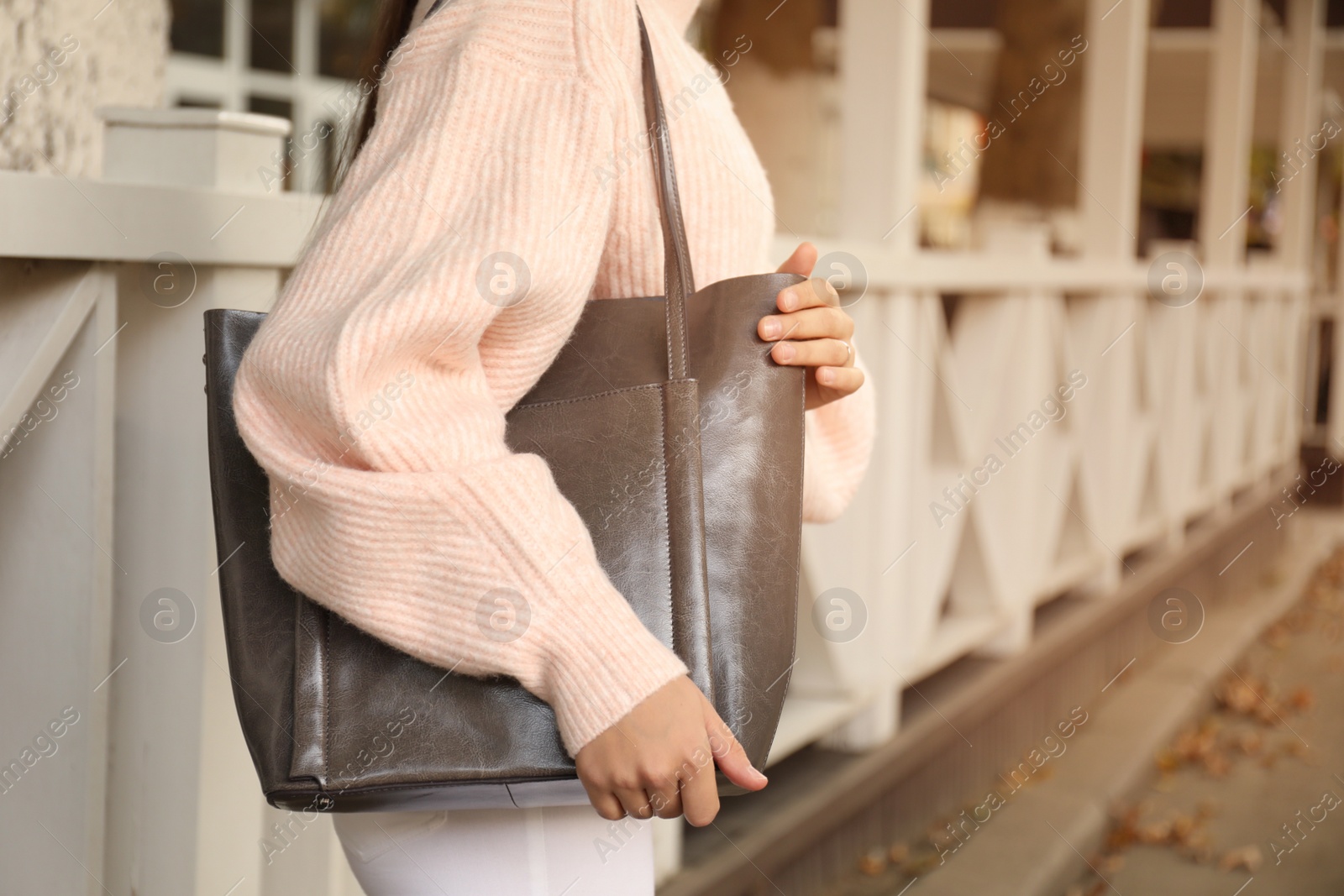 Photo of Woman with stylish shopper bag outdoors, closeup