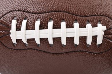 Photo of Leather rugby ball as background, closeup view