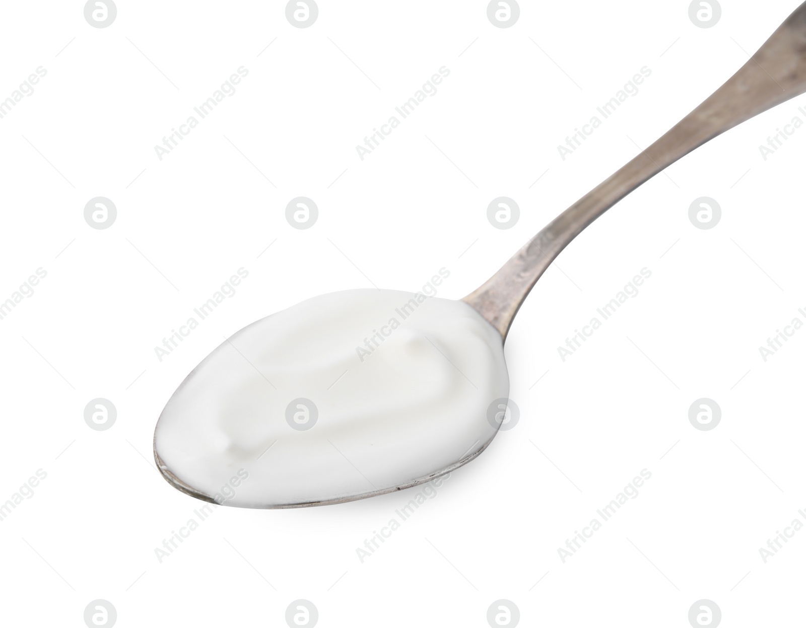 Photo of Delicious natural yogurt in spoon isolated on white