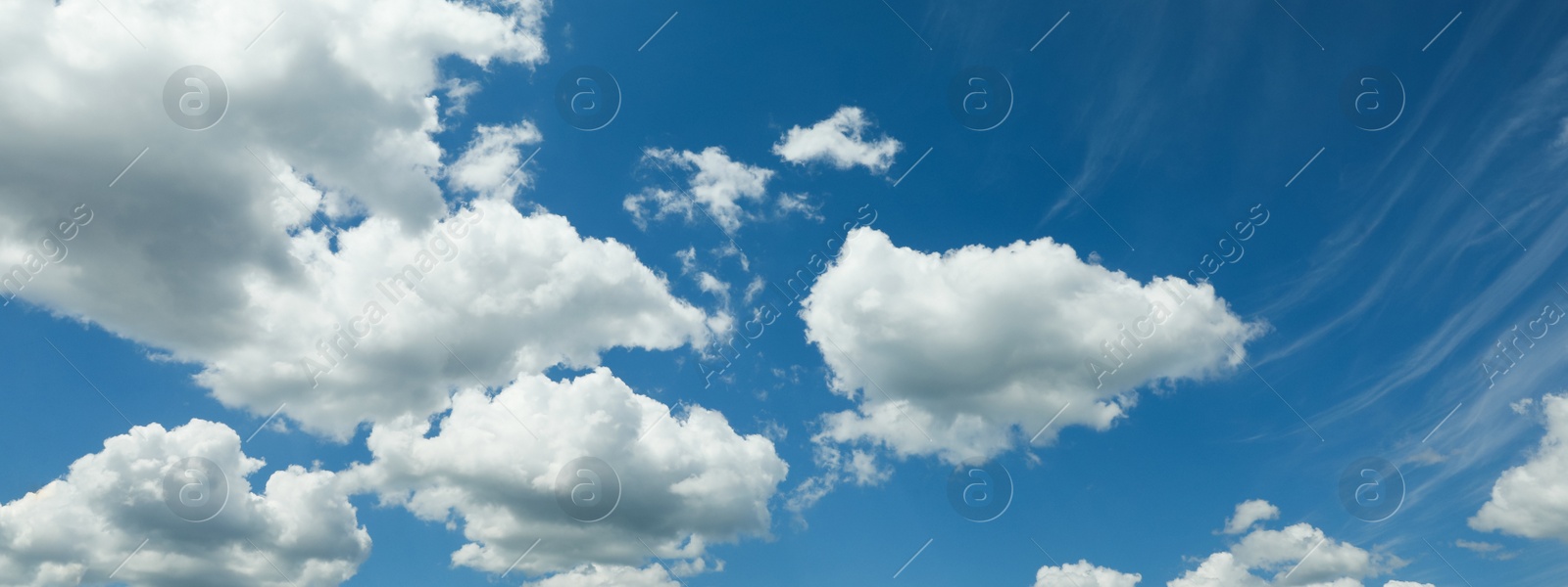 Image of Beautiful blue sky with white fluffy clouds. Banner design