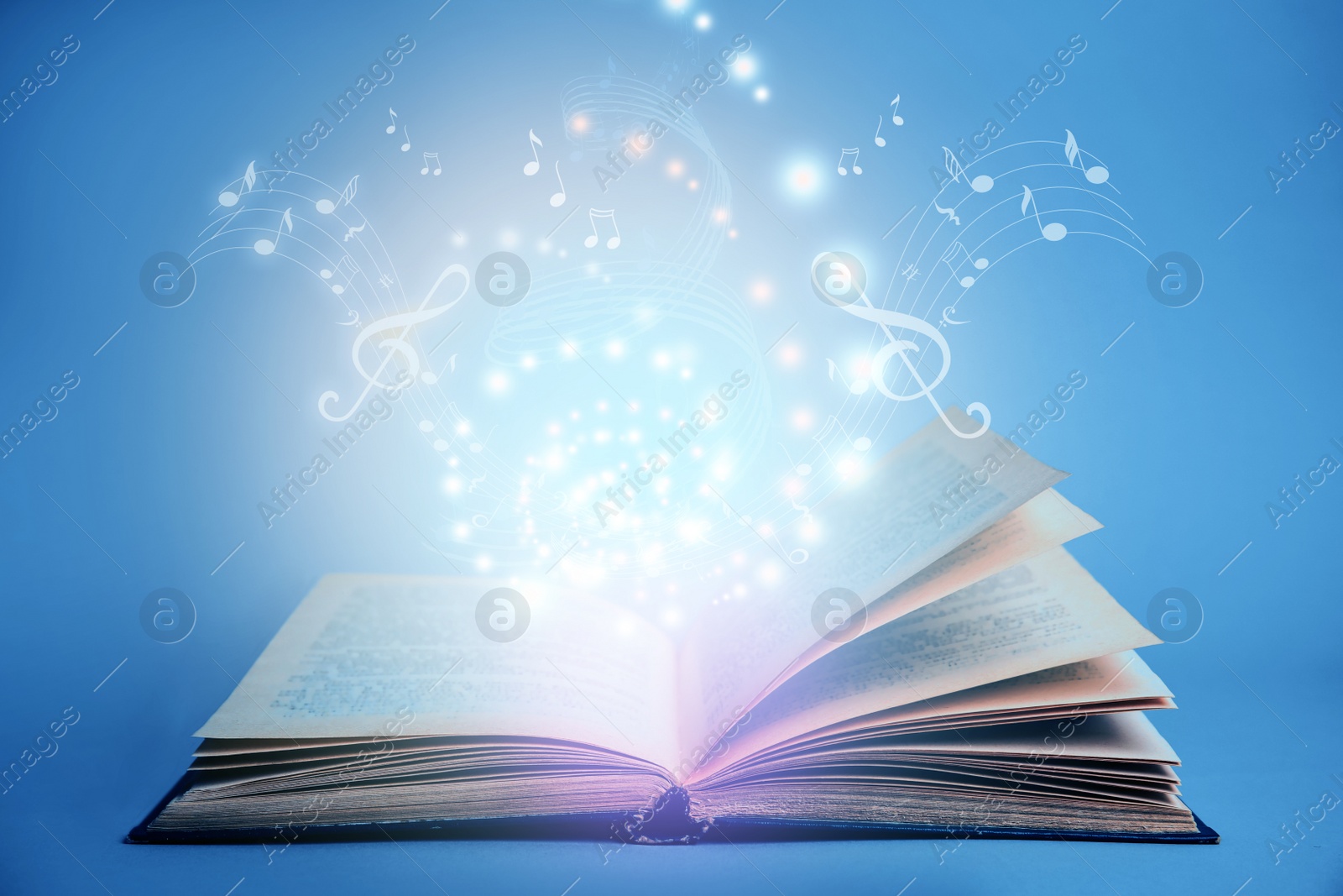 Image of Symphony shining with musical notes from open book on blue background 