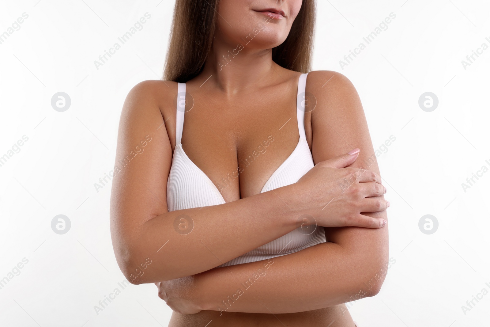 Photo of Woman with beautiful breast on white background, closeup