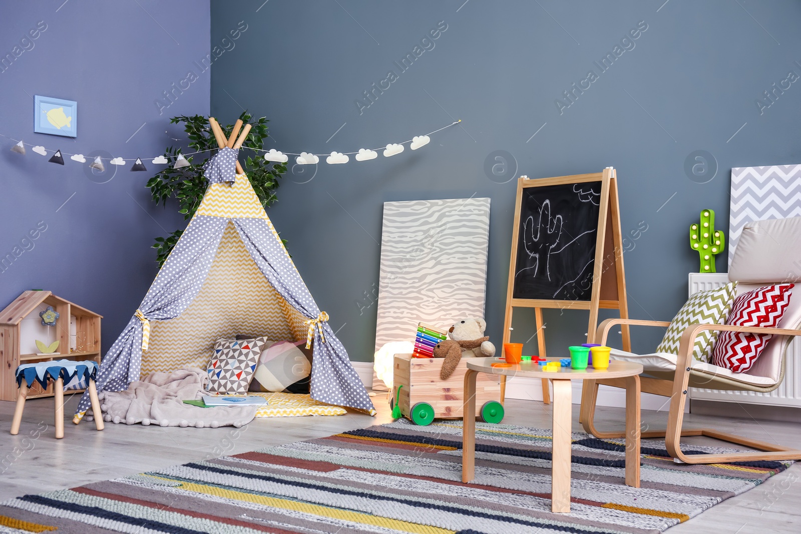 Photo of Modern room interior with play tent for child