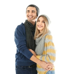 Young couple in warm clothing on white background. Ready for winter vacation