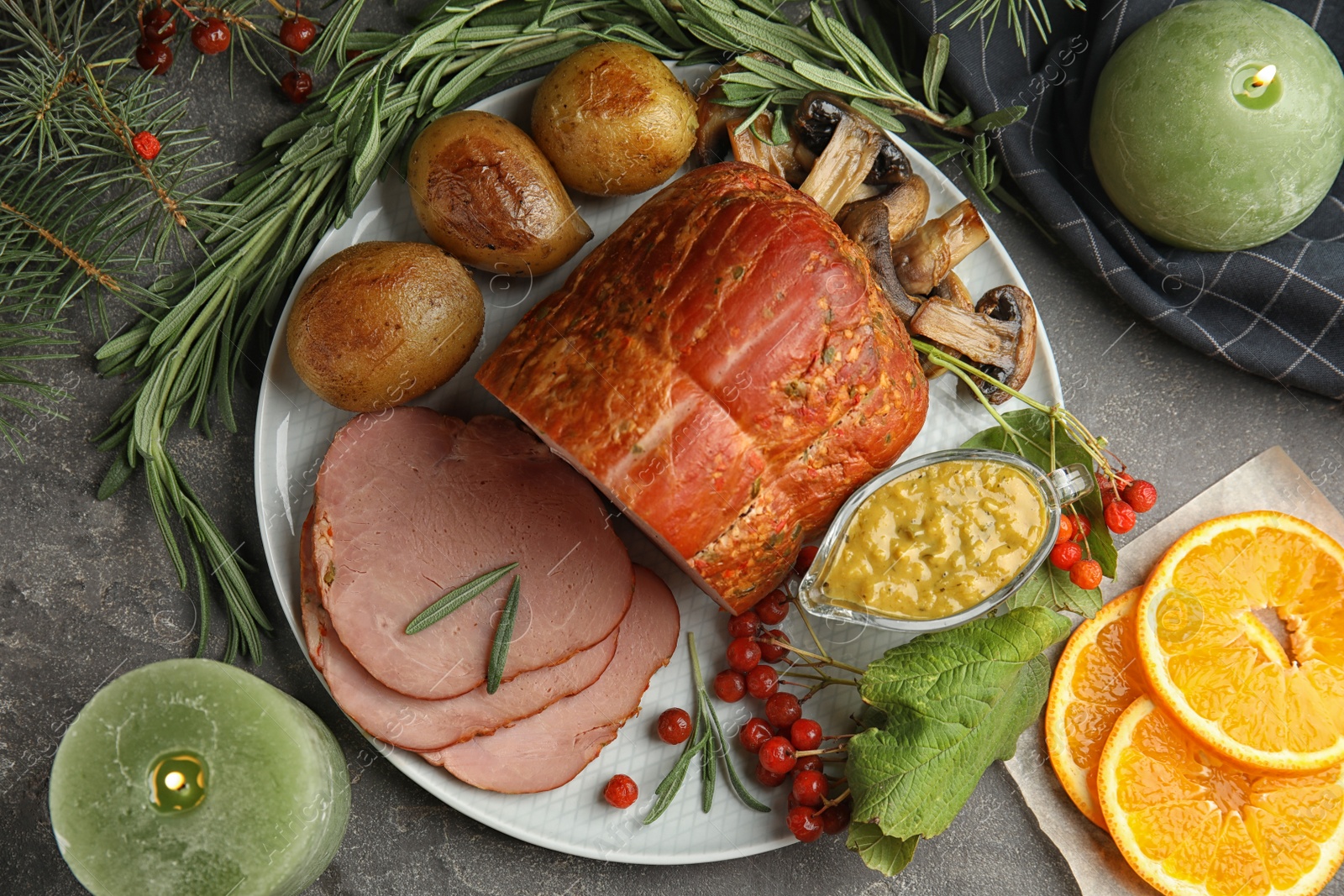 Photo of Flat lay composition with delicious ham on grey table. Christmas dinner