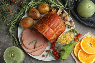 Photo of Flat lay composition with delicious ham on grey table. Christmas dinner