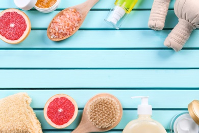 Photo of Flat lay composition with body care products on wooden background