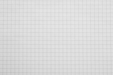 Checkered notebook sheet as background, top view