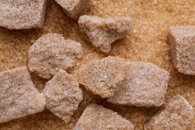 Refined and granulated brown sugar as background, closeup