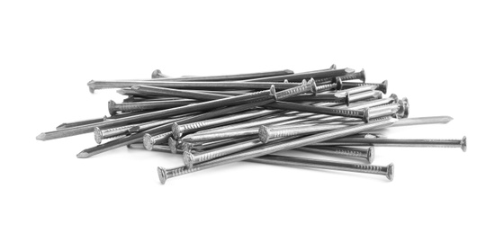 Photo of Pile of metal nails on white background