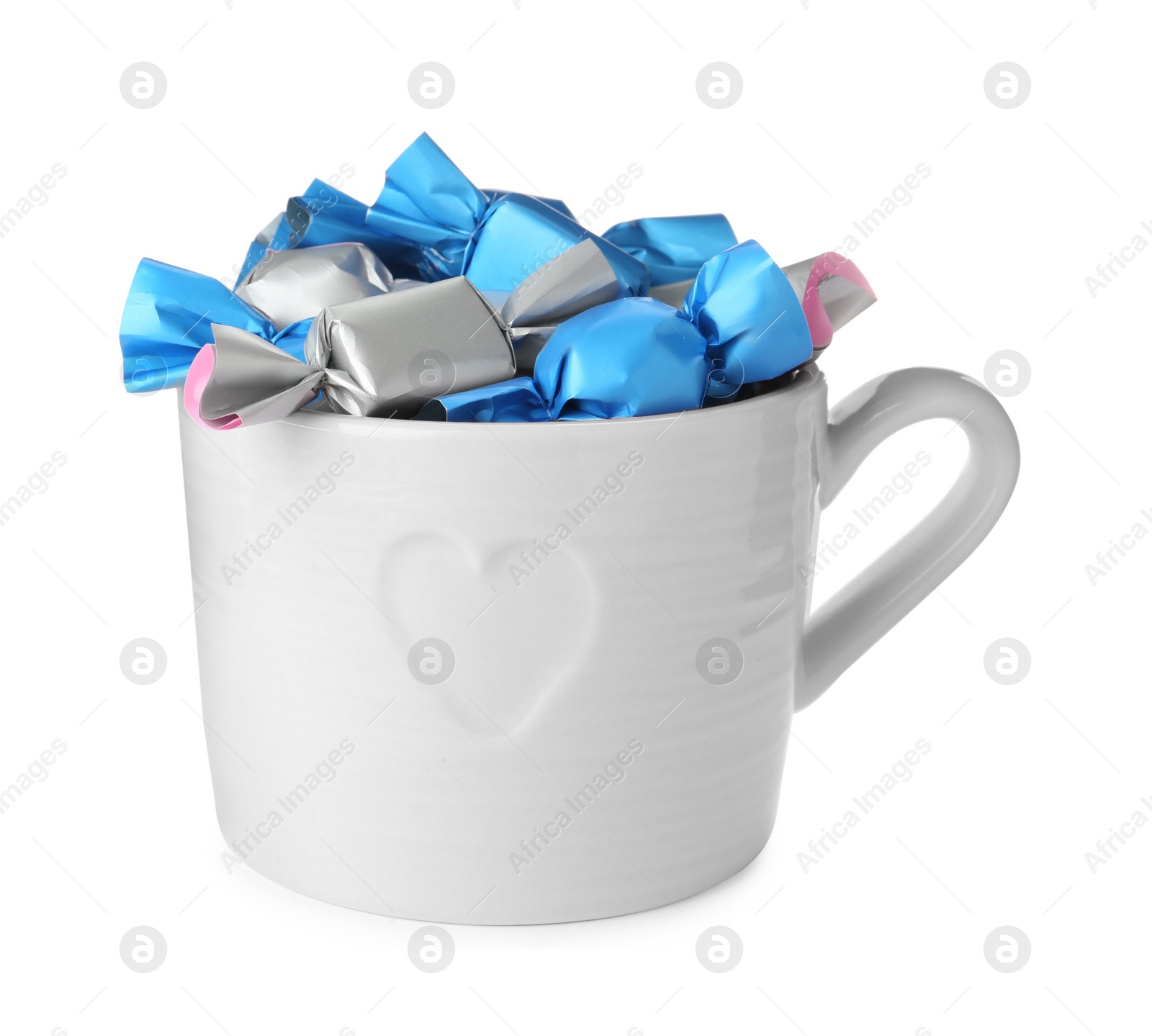 Photo of Cup with candies in colorful wrappers isolated on white