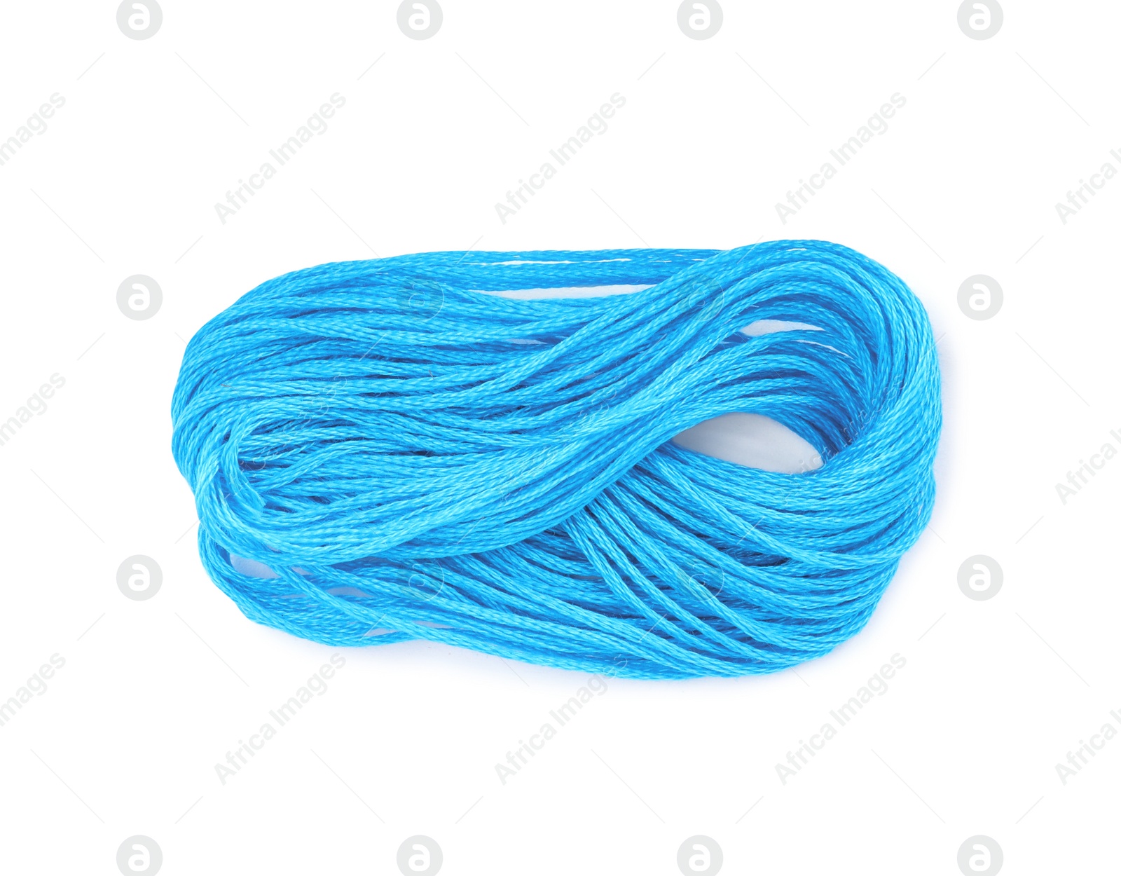 Photo of Light blue embroidery thread on white background