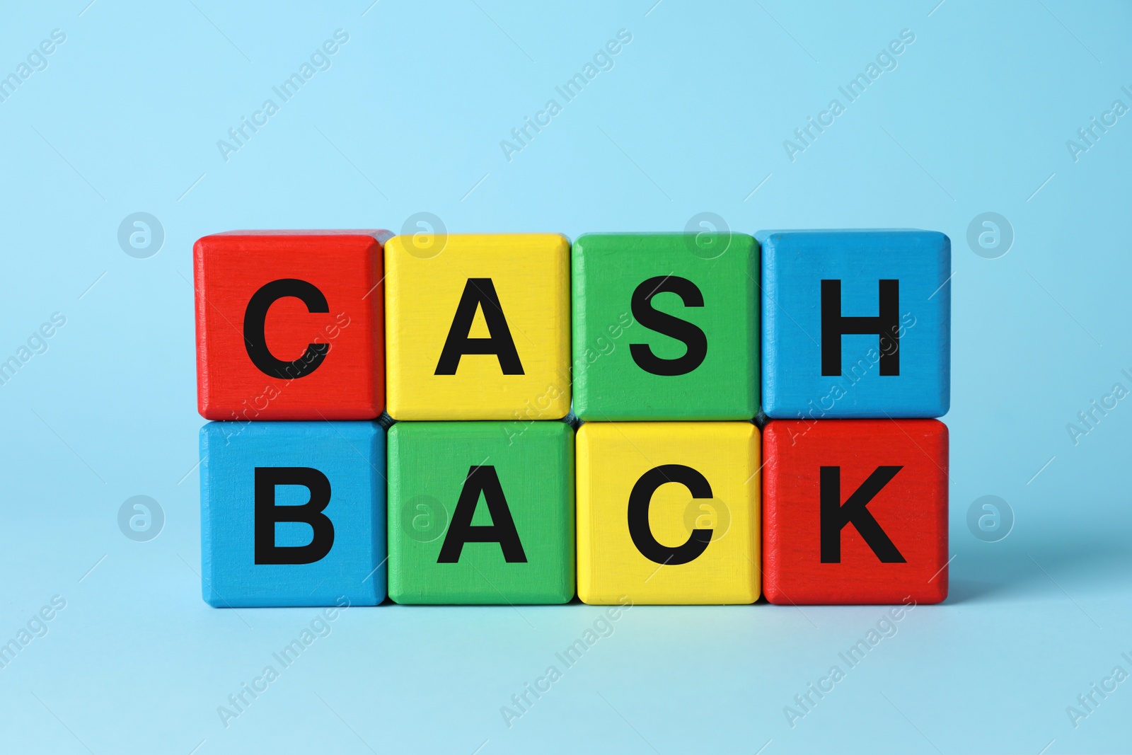 Photo of Word Cashback made with colorful cubes on light blue background