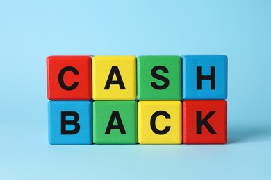 Word Cashback made with colorful cubes on light blue background