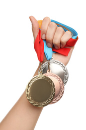 Woman holding medals on white background, closeup. Space for design