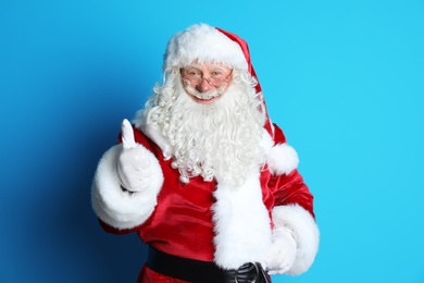 Photo of Portrait of authentic Santa Claus on color background