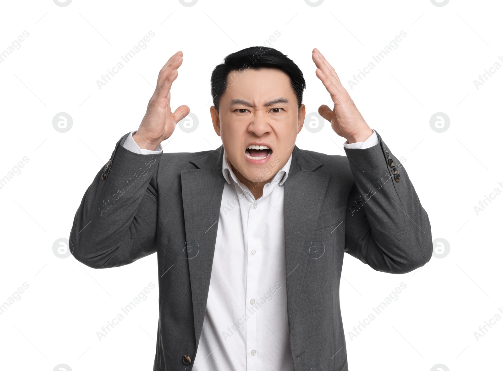 Photo of Angry businessman in suit screaming on white background