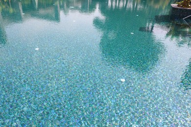 Photo of Clear water with ripples in swimming pool outdoors