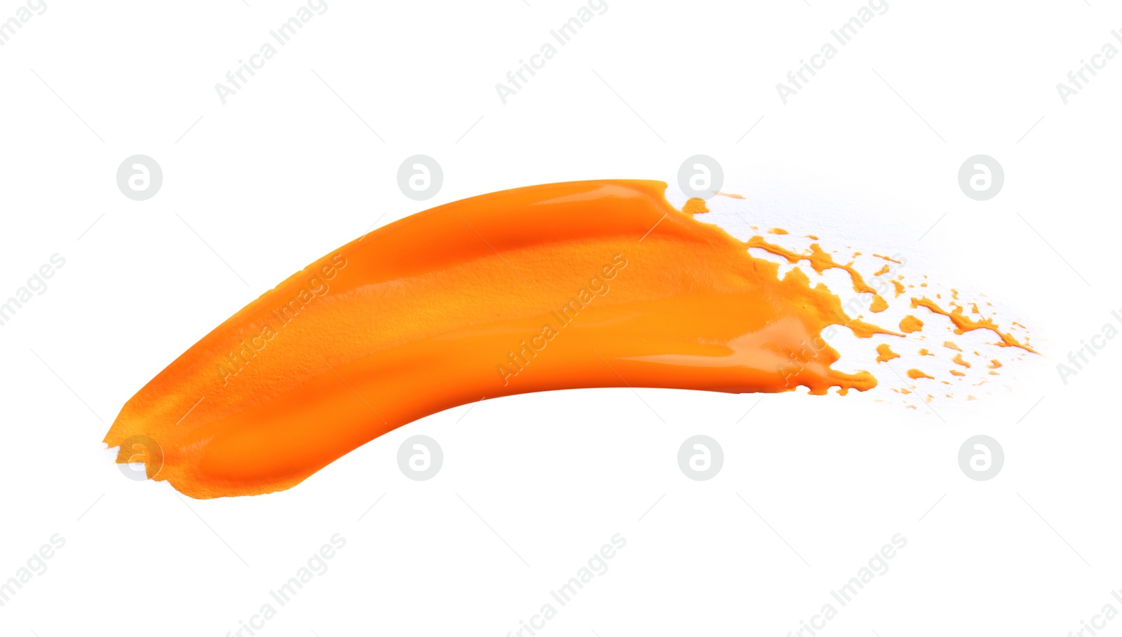 Photo of Abstract brushstroke of orange paint isolated on white