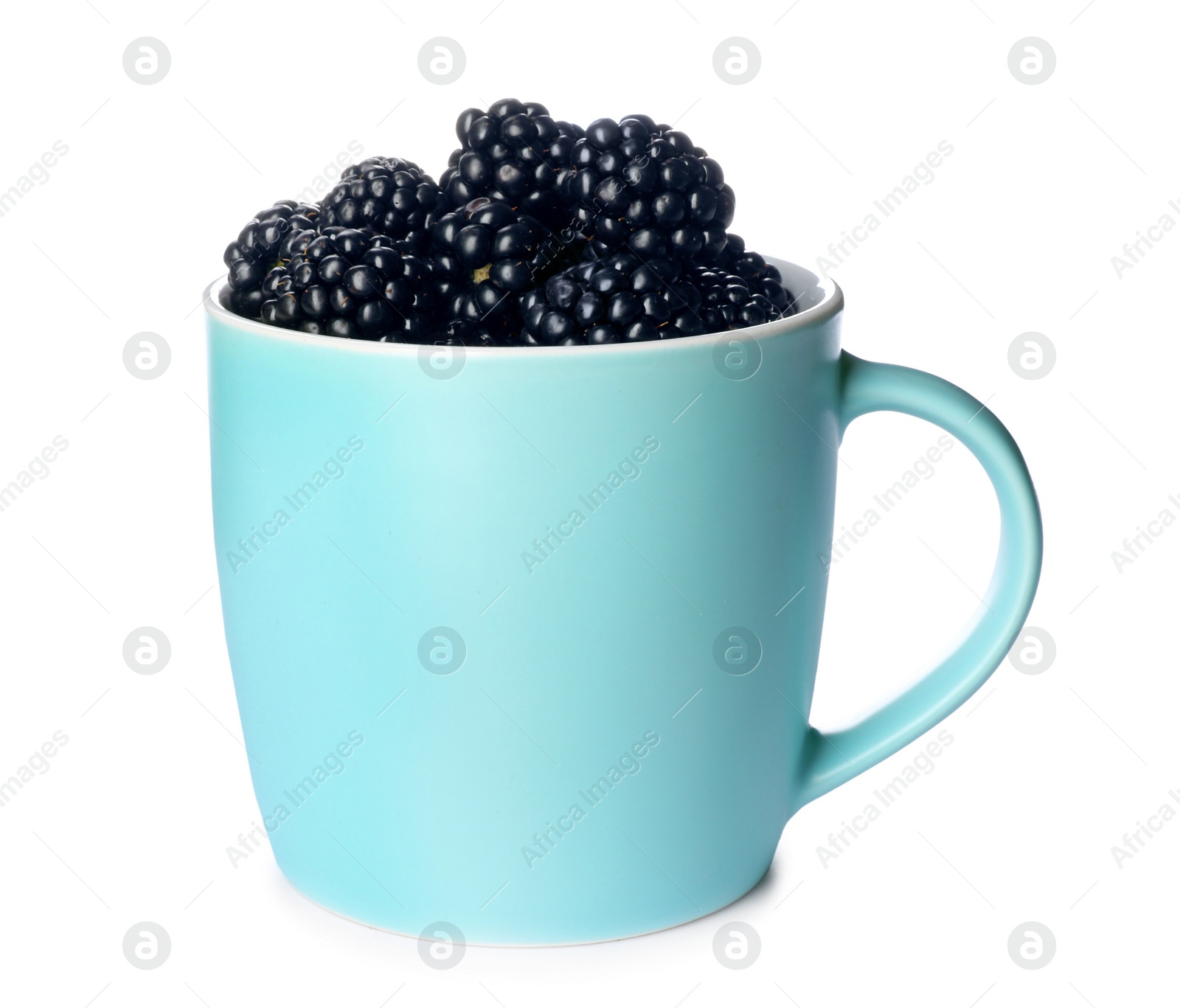 Photo of Mug with ripe blackberries on white background