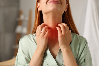 Photo of Suffering from allergy. Young woman scratching her neck in bathroom, closeup