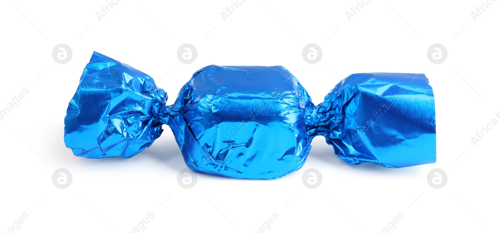 Photo of Tasty candy in blue wrapper isolated on white