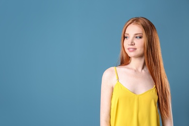 Photo of Portrait of young model with beautiful  hair on color background