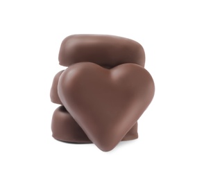 Beautiful heart shaped chocolate candies stacked on white background