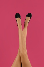 Photo of Woman wearing stylish shoes on pink background, closeup