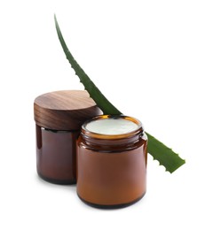 Jars of hand cream and aloe on white background