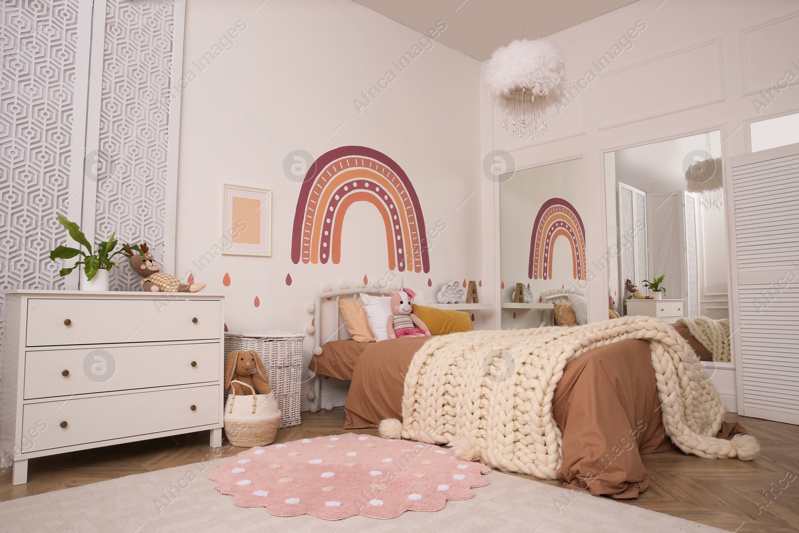Photo of Stylish room with comfortable bed for kids. Interior design