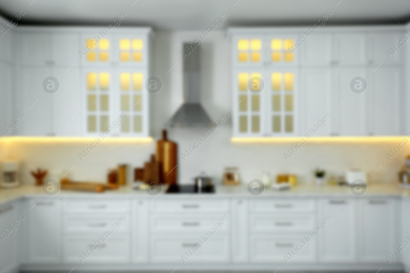 Photo of Blurred view of modern kitchen interior with stylish furniture