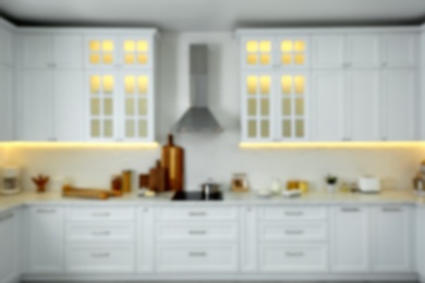 Blurred view of modern kitchen interior with stylish furniture