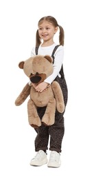 Photo of Cute girl with teddy bear on white background