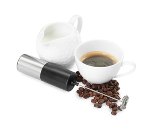 Mini mixer (milk frother), cup, coffee beans and pitcher isolated on white