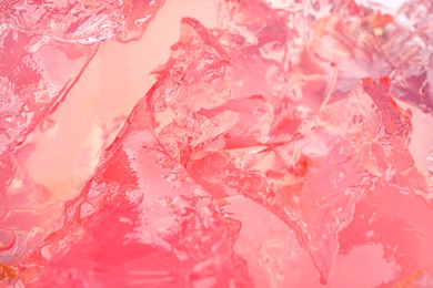 Photo of Delicious pink fruit jelly as background, closeup